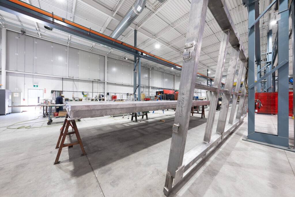 "Advanced metal fabrication process on display at ATH Custom Metal Fabrication's well-organized industrial workshop."